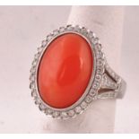 Diamond Set Oval Cabochon Form Coral Ring of Good Colour Mounted on 18 Carat White Gold with Further