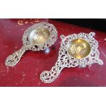 Two Antique Solid Silver Tea Strainers with Chased and Embossed Decoration Largest 6 Inches Long