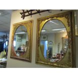 Pair of Gilded Oval Set Wall Mirrors with Foliate Detailing Each 36 Inches High x 24 Inches Wide