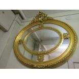Gilded Oval Mirror of Scrolled Cartouche Form 30 Inches High x 48 Inches Wide Approximately