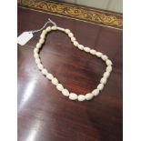 Carved Ivory Necklace with Floral Form Beads