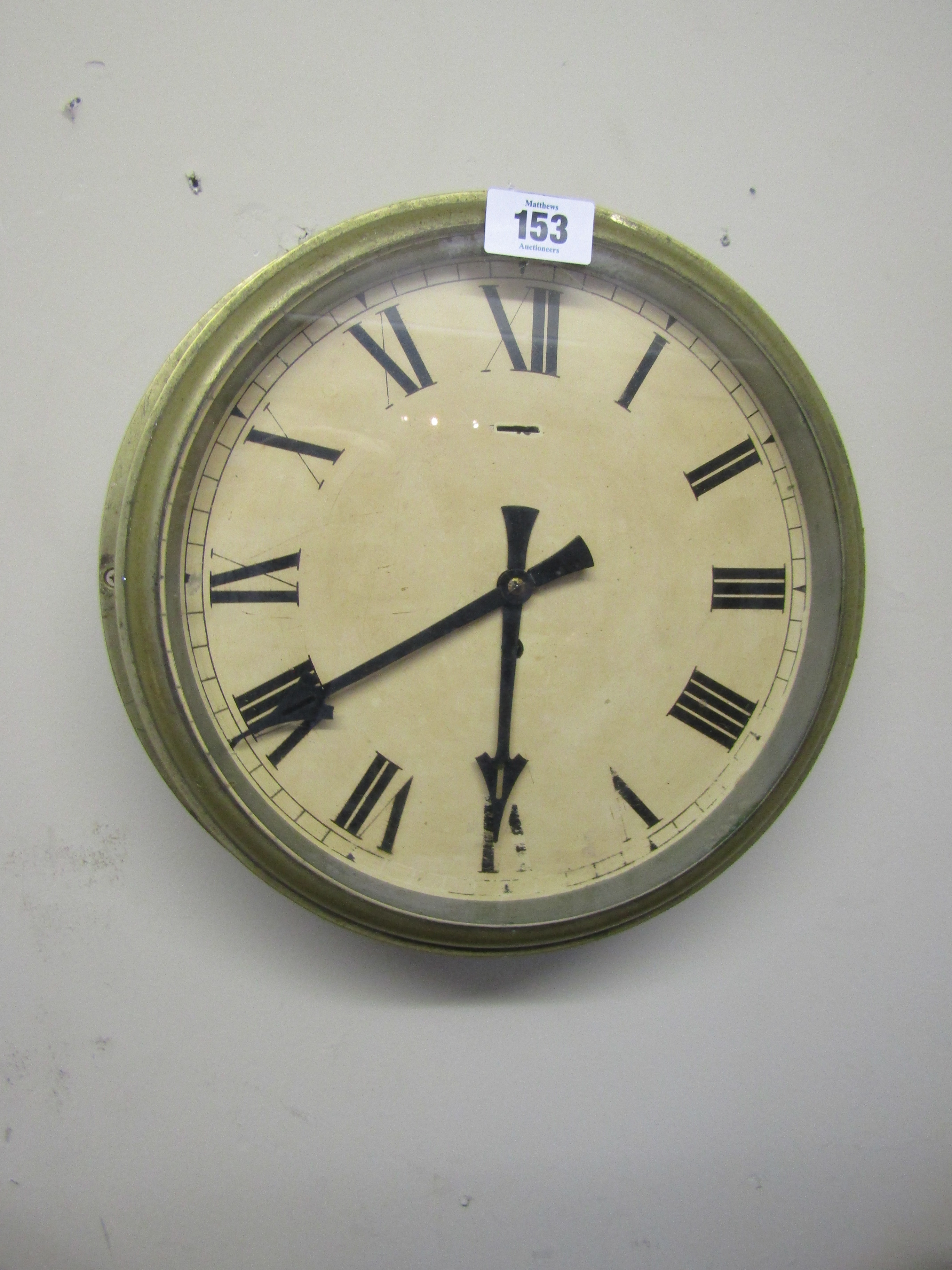 Antique Brass Bound Ships Clock of Large Size with Roman Numeral Decorated Dial 14 Inches Wide