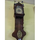 Antique Clock with Figures Surmounted and Roman Numeral Dial wall Mounted 34 Inches High