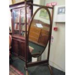 Antique Mahogany Cheval Mirror with Carved Frieze on Brass Castors 25 Inches Wide x 70 Inches High