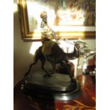 Bronze Sculpture of Camel with Herder Resting on Oval Form Base Approximately 15 Inches High