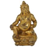 A GILT-BRONZE FIGURE OF KUBERA, MONGOLIA, 19TH CENTURY the pot-bellied deity seated on a lotus,