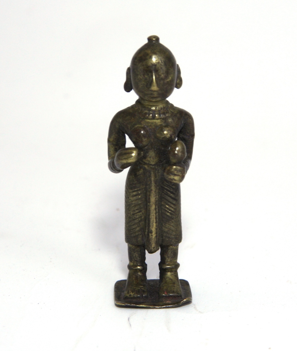 A SMALL BRONZE FIGURE OF DEVI, WESTERN INDIA, CIRCA 18TH CENTURY standing on a square base, her