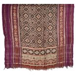 A SILK DOUBLE IKAT SARI (PATOLA), GUJARAT, 19TH CENTURY of long rectangular form, the field with