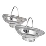 TWO GEORGE III SILVER SWEETMEAT BASKETS, ALEXANDER FIELD, LONDON, 1800 boat-shaped, applied reeded