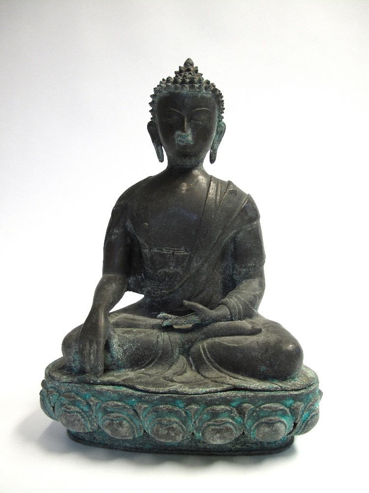 A BRONZE FIGURE OF BUDDHA, NEPAL, 20TH CENTURY in 17th century style, seated in dhyanasana on a