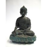 A BRONZE FIGURE OF BUDDHA, NEPAL, 20TH CENTURY in 17th century style, seated in dhyanasana on a