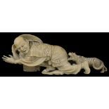 ˜A JAPANESE IVORY OKIMONO OF A FARMER, MEIJI PERIOD (1868-1912) carved crawling away from a rabid