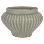 A CHINESE CELADON SMALL JAR, YUAN DYNASTY (1279-1368) lobed ogee body, on a recessed base, olive