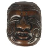 A JAPANESE WOOD MASK NETSUKE OF AN OLD MAN, LATE EDO PERIOD, CIRCA 1820 signed Kosai 4.9cm high