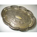 A SILVER TRAY, LUCKNOW, EASTERN INDIA, CIRCA 1900 of oval scallopped form, the central inscribed
