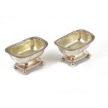 A PAIR OF GEORGE III SILVER SALT CELLARS, MAKER'S MARKS RUBBED, LONDON, 1818 pedestal oblong, on