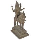 A BRONZE FIGURE OF SIVA RIDING ON NANDI BULL, INDIA, LATE 19TH CENTURY the four-armed god holding an