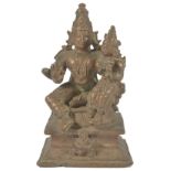 A BRONZE GROUP DEPICTING LAKSHMI NARAYANA, SOUTH INDIA, CIRCA 18TH CENTURY the god Vishnu seated