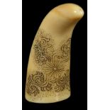˜A JAPANESE WHALE TOOTH NETSUKE, LATE EDO PERIOD, CIRCA 1860 engraved and inked with a design of