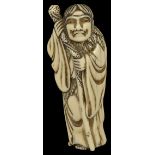 ˜A JAPANESE IVORY NETSUKE OF TEKKAI SENNIN, LATE EDO PERIOD, CIRCA 1820 standing hugging his