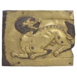 A COPPER-GILT REPOUSSE PANEL, TIBET, 18TH CENTURY of rectangular form depicting a lion with