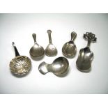 FIVE SILVER CADDY SPOONS, ENGLISH, SCOTTISH AND GERMAN, EARLY 20TH CENTURY including a plain