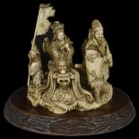 ˜A JAPANESE IVORY OKIMONO GROUP OF SEA GODS, MEIJI PERIOD (1868-1912) carved with a central female