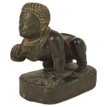 A DARK GREY STONE FIGURE OF BALAKRISHNA, NEPAL, CIRCA 17TH CENTURY the infant deity depicted