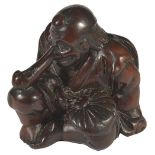 A JAPANESE PLUM WOOD NETSUKE OF SOJOBO, THE TENGU KING, LATE EDO PERIOD, CIRCA 1820 seated with