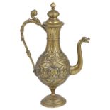 A BRASS REPOUSSE EWER, JAIPUR SCHOOL OF ART, INDIA, CIRCA 1890 of bulbous form, the scrolling