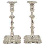 A PAIR OF GEORGE II SILVER CANDLESTICKS, WILLIAM SHAW & WILLIAM PREIST, LONDON, 1757 cast shell