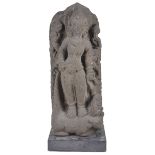 A JAVANESE VOLCANIC STONE STELE DEPICTING DURGA MAHISASURAMARDINI, INDONESIA, CIRCA 9TH CENTURY