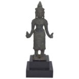 A KHMER BRONZE FIGURE OF UMA (?), CAMBODIA, CIRCA 12TH CENTURY standing on a square base, her