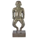 A LARGE TINNED BRONZE FIGURE OF THE INFANT KRISHNA, INDIA, 19TH CENTURY solid cast, the nude plump