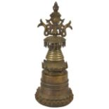 A BRONZE STUPA, TIBET, 18TH CENTURY in Pala style, the drum with lotus base and sealing plate