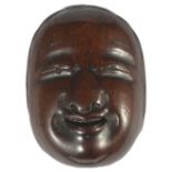 A JAPANESE WOOD MASK NETSUKE OF A WOMAN, LATE EDO PERIOD, CIRCA 1820 signed Deme Joman with kao