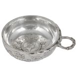 A FRENCH SILVER WINE TASTER, LATE 19TH CENTURY circular, entwined snake handle, the sides with