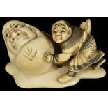 ˜A JAPANESE IVORY NETSUKE OF A KARAKO AND YUKI-DARUMA SNOWBALL, LATE EDO PERIOD, CIRCA 1860 the