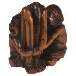 A JAPANESE WOOD NETSUKE OF ASHINAGA AND TENAGA, LATE EDO PERIOD, CIRCA 1820 seated close together,