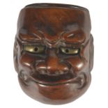 A JAPANESE WOOD MASK NETSUKE OF BESHIMI, LATE EDO PERIOD, CIRCA 1820 the eyes inset with gilt