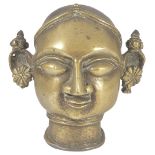 A BRONZE GAURI HEAD, WESTERN INDIA, 19TH CENTURY with large almond shaped eyes, prominent nose and