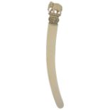 ˜A CARVED IVORY PAPER KNIFE, SRI LANKA, CIRCA 1900 with curved blade, the terminal relief carved