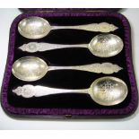 A SET OF FOUR VICTORIAN PARCEL-GILT SILVER FRUIT SERVING SPOONS, LIAS & WAKELY, LONDON, 1883 the