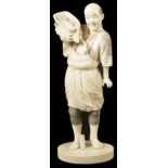 ˜A JAPANESE IVORY OKIMONO OF A FISHERMAN, LATE MEIJI PERIOD, CIRCA 1900 standing wearing a straw