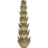 A BRASS TEMPLE LAMP OR CENSER, SOUTHERN INDIA, CIRCA 19TH CENTURY in the form of a tapering stack of