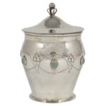 AN ARTS AND CRAFTS SILVER JAR AND COVER, A.E. JONES, BIRMINGHAM, 1908 the hammered ovoid body set