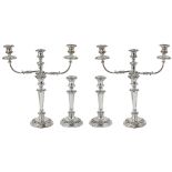 A SET OF FOUR SILVER CANDLESTICKS AND A PAIR OF SHEFFIELD PLATE CANDELABRA BRANCHES, JOHN & THOMAS