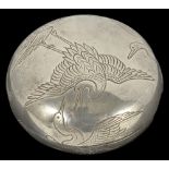 A JAPANESE SILVER TWO-PART MANJU NETSUKE, MEIJI PERIOD (1868-1912) engraved with flying cranes,