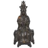 A CHINESE GILT-LACQUERED BRONZE DEITY, MING DYNASTY, 16TH / 17TH CENTURY cast seated on a throne
