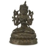 A BRONZE FIGURE OF MAITREYA, TIBET, CIRCA 16TH CENTURY seated on a double lotus throne, his hands in
